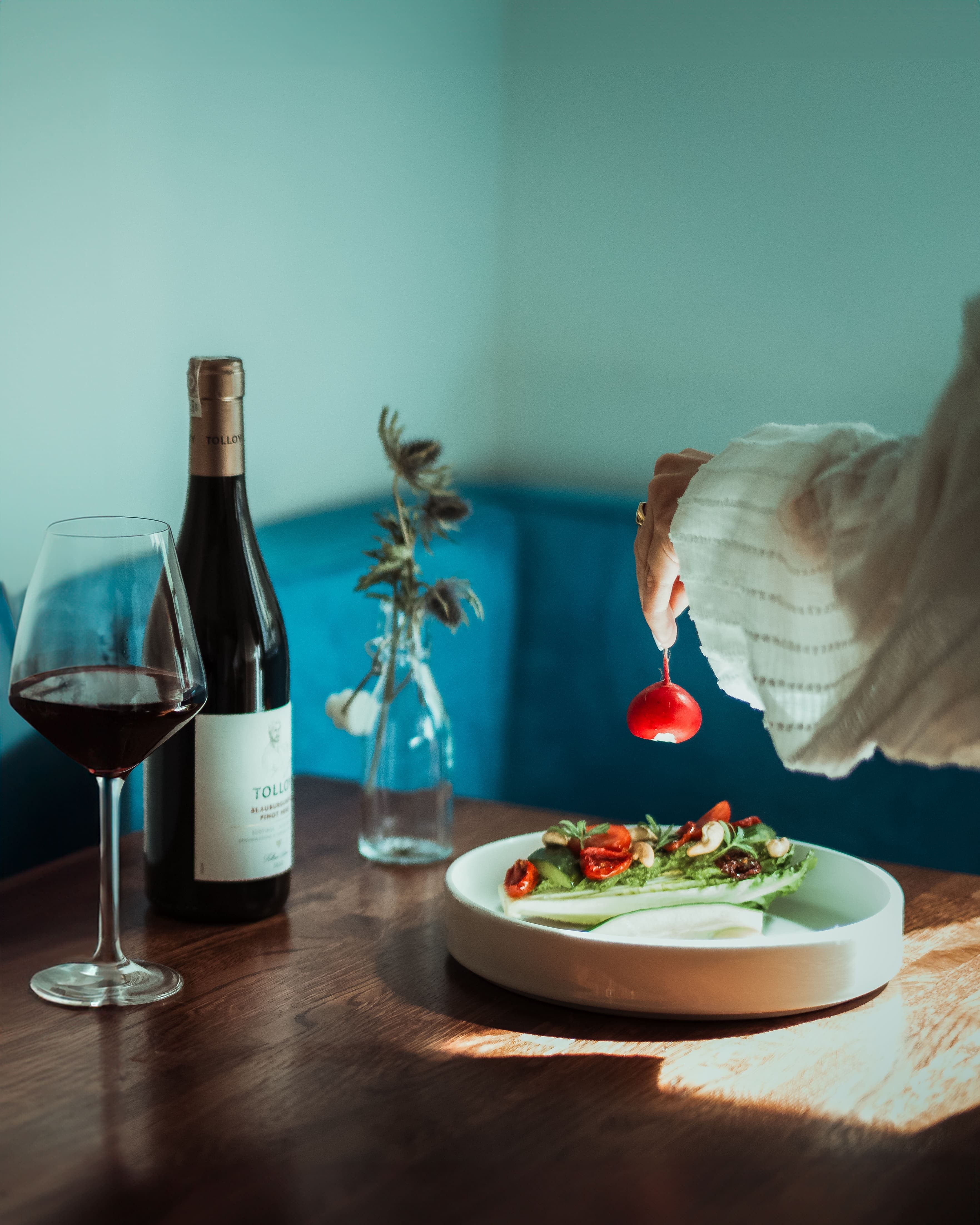 Olive-toned dish composition with dark backdrop