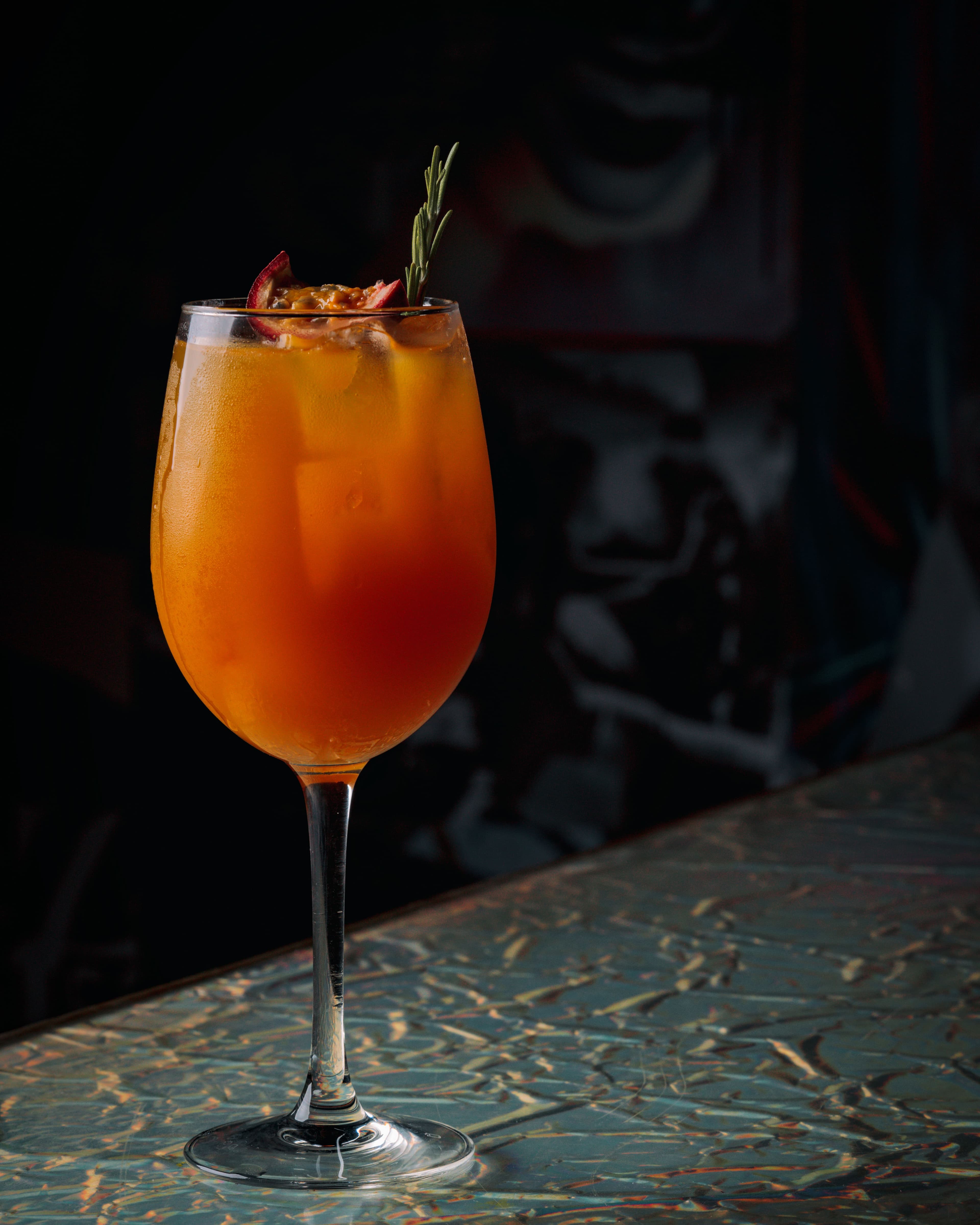 Orange vermouth cocktail with garnish detail