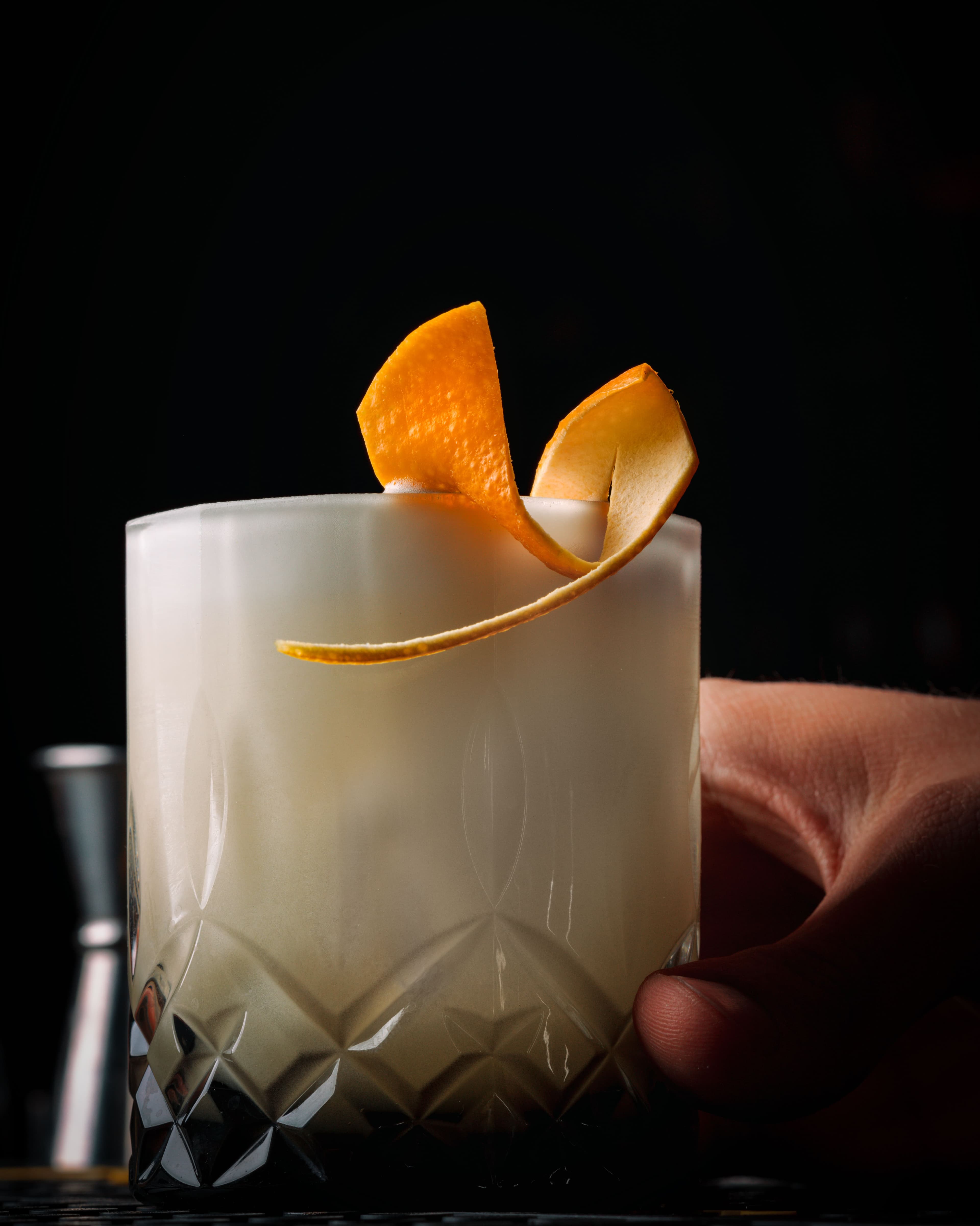 Minimal cocktail shot with glass reflections